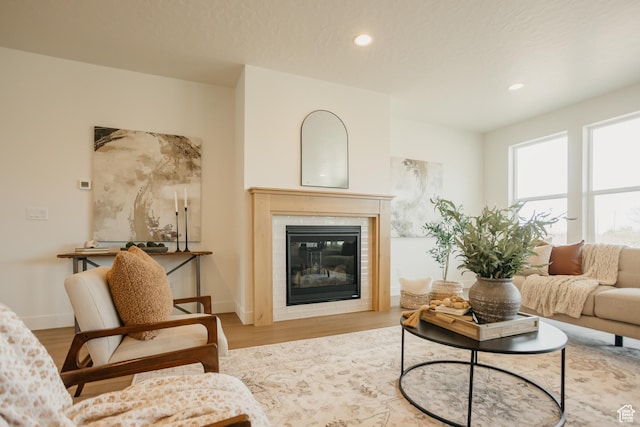 3757 E 1120, Spanish Fork, UT 84660 - living room featuring a tiled fireplace, wood finished floors, and recessed lighting