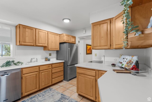 875 S Donner Way E Unit 302, Salt Lake City, UT 84108 - kitchen with appliances with stainless steel finishes, light countertops, and light tile patterned floors