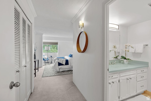 875 S Donner Way E Unit 302, Salt Lake City, UT 84108 - hall with light carpet, ornamental molding, and a textured ceiling