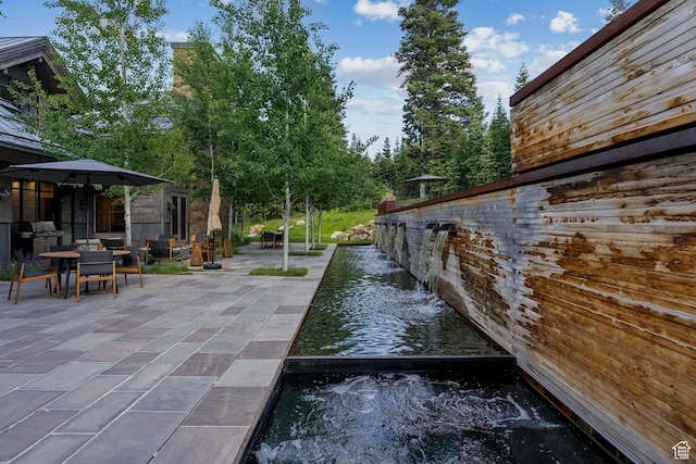 2505 W White Pine Ln, Park City, UT 84060 - view of patio featuring outdoor dining area and a water view