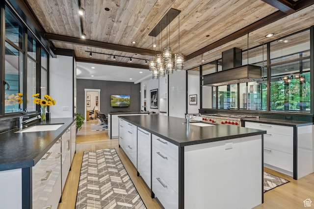 2505 W White Pine Ln, Park City, UT 84060 - kitchen featuring dark countertops, modern cabinets, light wood finished floors, white cabinetry, and wooden ceiling