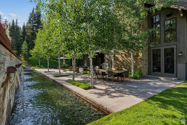 2505 W White Pine Ln, Park City, UT 84060 - view of yard with french doors, a patio, and a water view