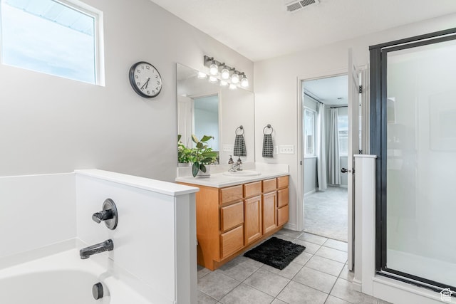 17 S Belmont Dr, Farmington, UT 84025 - bathroom with vanity, tile patterned floors, plenty of natural light, and a garden tub