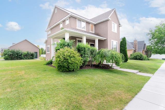 17 S Belmont Dr, Farmington, UT 84025 - view of front of home featuring a front yard, stucco siding, and covered porch