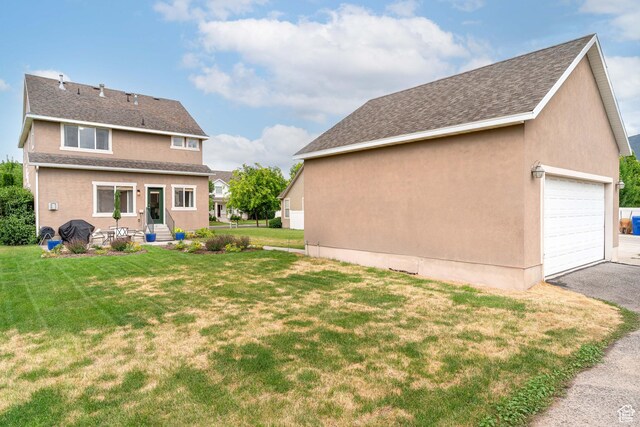 17 S Belmont Dr, Farmington, UT 84025 - back of house featuring a garage, a yard, and a shingled roof
