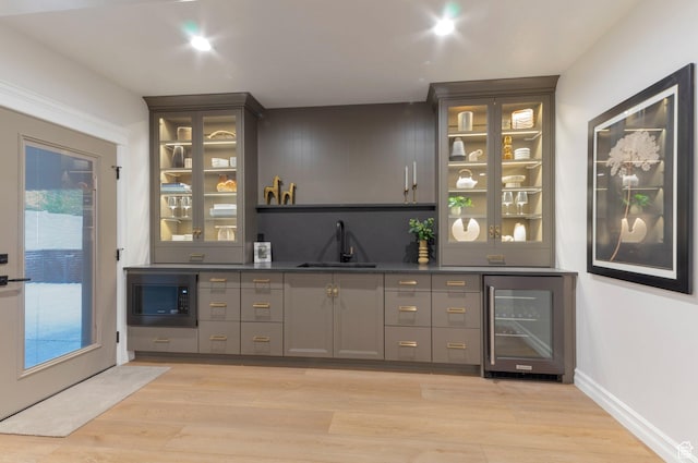1649 W Pheasant Meadow Dr, Kaysville, UT 84037 - indoor wet bar featuring beverage cooler, built in microwave, and light wood finished floors