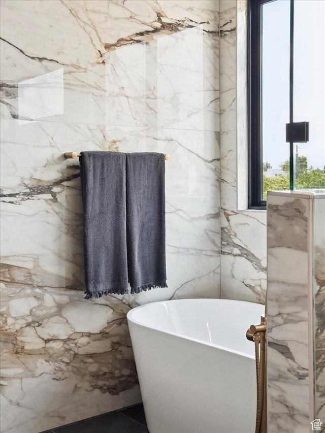 1649 W Pheasant Meadow Dr, Kaysville, UT 84037 - bathroom with a soaking tub and tile walls