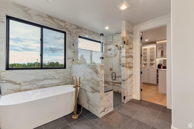1649 W Pheasant Meadow Dr, Kaysville, UT 84037 - bathroom with a freestanding tub, a marble finish shower, a walk in closet, and recessed lighting
