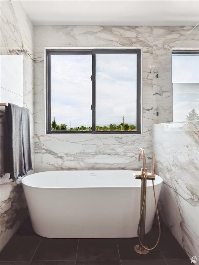 1649 W Pheasant Meadow Dr, Kaysville, UT 84037 - bathroom featuring a freestanding bath, tile walls, and tile patterned floors