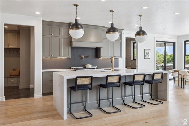 1649 W Pheasant Meadow Dr, Kaysville, UT 84037 - kitchen featuring custom exhaust hood, backsplash, light countertops, a spacious island, and recessed lighting