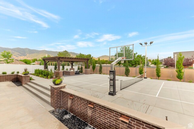 1649 W Pheasant Meadow Dr, Kaysville, UT 84037 - view of patio with a pergola, a mountain view, community basketball court, an outdoor living space, and a tennis court