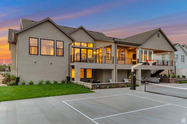 1649 W Pheasant Meadow Dr, Kaysville, UT 84037 - back of house featuring stucco siding, a tennis court, a balcony, stairs, and a patio area