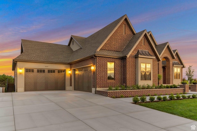 1649 W Pheasant Meadow Dr, Kaysville, UT 84037 - view of front of property featuring a garage, driveway, roof with shingles, and brick siding