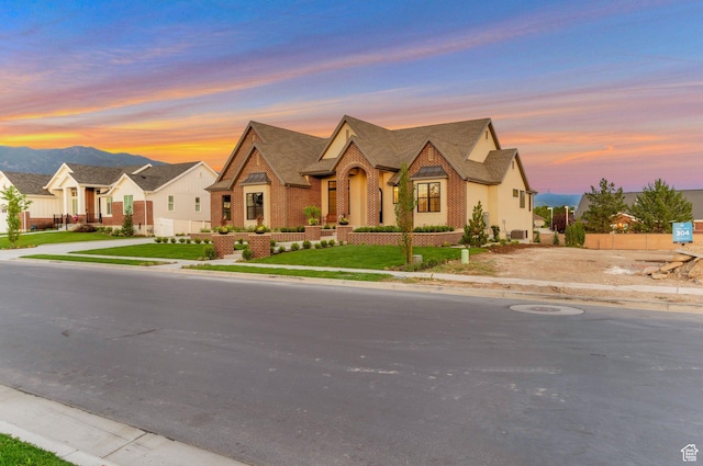 1649 W Pheasant Meadow Dr, Kaysville, UT 84037 - view of front of property featuring brick siding, roof with shingles, and a mountain view
