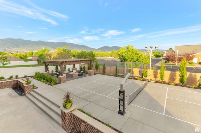 1649 W Pheasant Meadow Dr, Kaysville, UT 84037 - view of patio / terrace with a pergola, a tennis court, a mountain view, and an outdoor hangout area