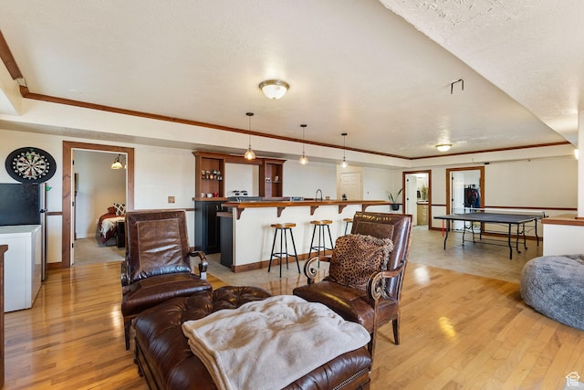 2151 E Village Vista Dr, Draper, UT 84020 - living room with light wood finished floors and crown molding