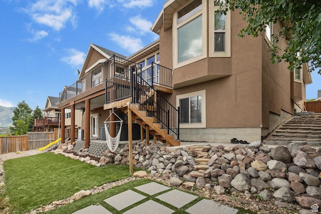 2151 E Village Vista Dr, Draper, UT 84020 - back of property with stairs, stucco siding, and a deck