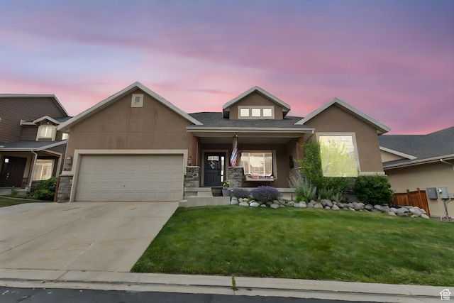 2151 E Village Vista Dr, Draper, UT 84020 - view of front of house featuring a garage, a yard, driveway, and stucco siding