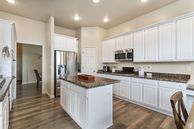 2151 E Village Vista Dr, Draper, UT 84020 - kitchen featuring stainless steel appliances, white cabinets, a kitchen island, dark wood-style floors, and recessed lighting