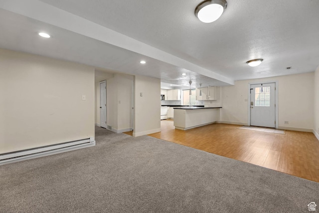 9448 S Lady Dove Ln, South Jordan, UT 84095 - unfurnished living room with light carpet, a baseboard radiator, and recessed lighting