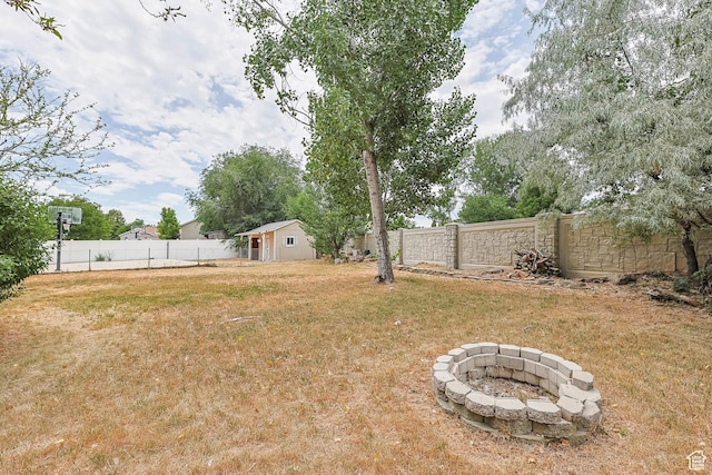 9448 S Lady Dove Ln, South Jordan, UT 84095 - fenced backyard with an outdoor fire pit and an outbuilding