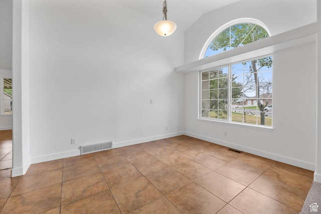 9448 S Lady Dove Ln, South Jordan, UT 84095 - unfurnished dining area with tile patterned floors and vaulted ceiling