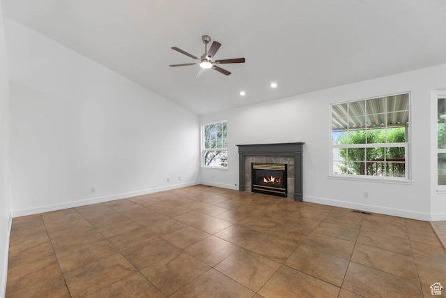 9448 S Lady Dove Ln, South Jordan, UT 84095 - unfurnished living room featuring a tile fireplace, lofted ceiling, ceiling fan, recessed lighting, and tile patterned floors