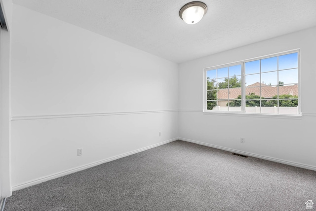 9448 S Lady Dove Ln, South Jordan, UT 84095 - carpeted spare room featuring baseboards and a textured ceiling