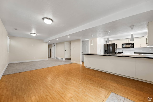 9448 S Lady Dove Ln, South Jordan, UT 84095 - unfurnished living room featuring light wood-type flooring, a baseboard heating unit, and recessed lighting
