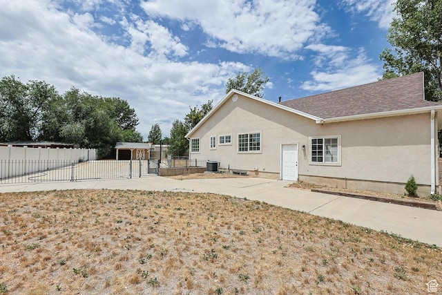 9448 S Lady Dove Ln, South Jordan, UT 84095 - rear view of house with stucco siding, a patio area, and roof with shingles