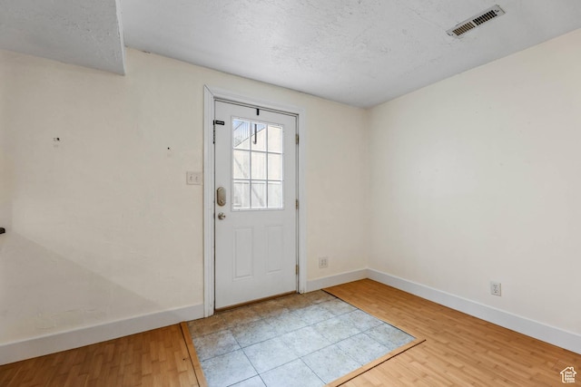 9448 S Lady Dove Ln, South Jordan, UT 84095 - doorway with wood finished floors and a textured ceiling
