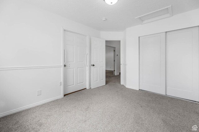 9448 S Lady Dove Ln, South Jordan, UT 84095 - unfurnished bedroom featuring attic access, carpet, and a closet