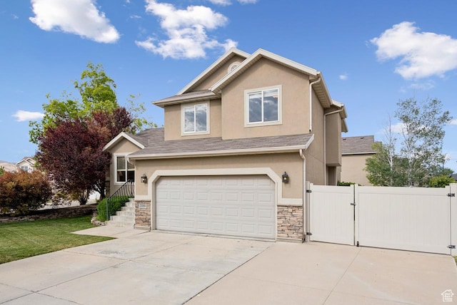 2188 N 2270 W, Lehi, UT 84043 - view of front facade featuring a gate, concrete driveway, stucco siding, and a garage