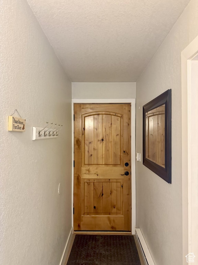 1530 Empire Ave Unit 200, Park City, UT 84060 - doorway with a textured ceiling, baseboard heating, and a textured wall