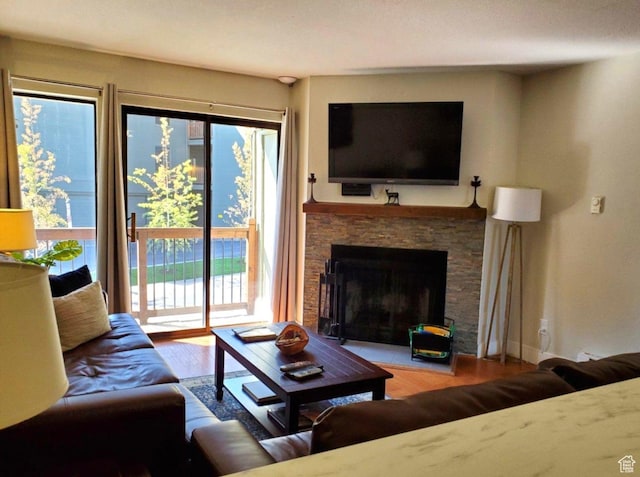 1530 Empire Ave Unit 200, Park City, UT 84060 - living room with wood finished floors and a stone fireplace