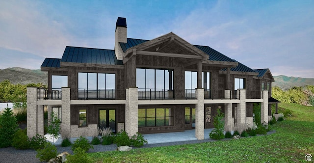 1550 Red Hawk Trl Unit 25, Snyderville, UT 84098 - rear view of property with a standing seam roof, a balcony, a metal roof, and a chimney