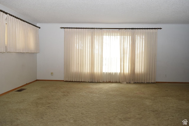 519 Edgehill Pl, East Carbon, UT 84520 - carpeted empty room with a textured ceiling