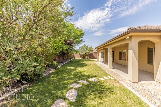 2866 E Carmine Dr, St George, UT 84790 - fenced backyard featuring a patio area