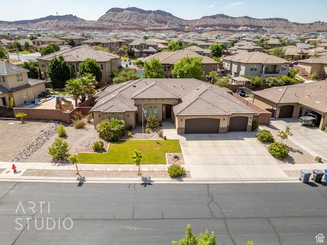 2866 E Carmine Dr, St George, UT 84790 - view of front facade with a residential view, an attached garage, stucco siding, and concrete driveway
