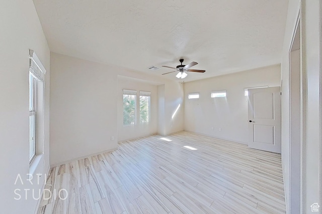 2866 E Carmine Dr, St George, UT 84790 - empty room with ceiling fan, light wood-type flooring, and a textured ceiling