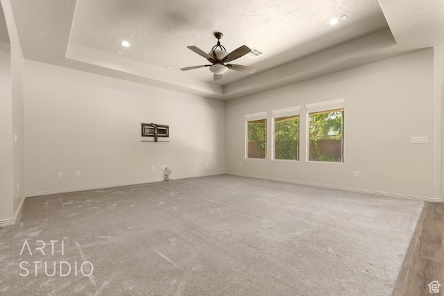 2866 E Carmine Dr, St George, UT 84790 - carpeted empty room featuring a tray ceiling, ceiling fan, a textured ceiling, and recessed lighting