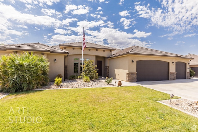 2866 E Carmine Dr, St George, UT 84790 - mediterranean / spanish-style house featuring an attached garage, concrete driveway, a front yard, and stucco siding