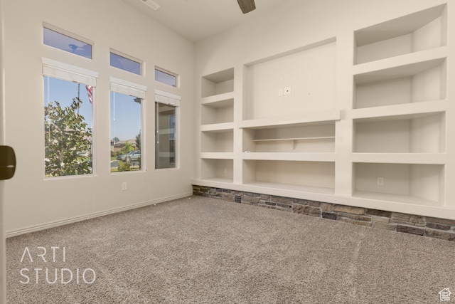 2866 E Carmine Dr, St George, UT 84790 - carpeted empty room featuring a ceiling fan and built in features