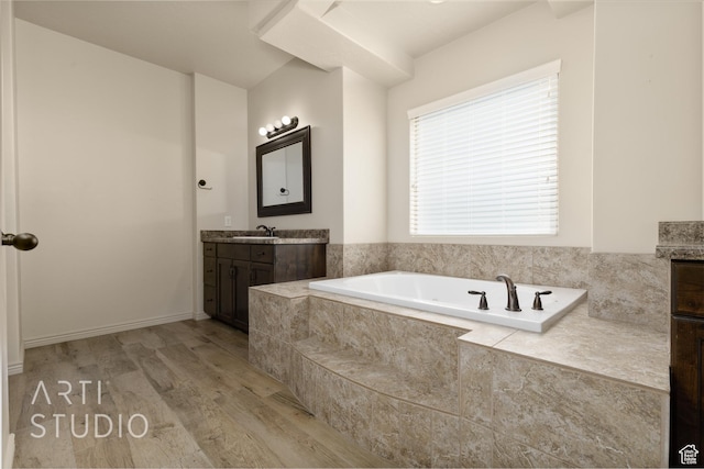 2866 E Carmine Dr, St George, UT 84790 - bathroom with vanity, a bath, and wood finished floors