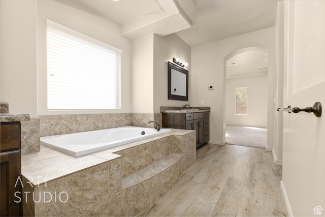 2866 E Carmine Dr, St George, UT 84790 - full bathroom featuring vanity, a garden tub, and wood finished floors