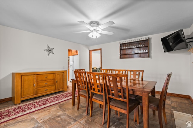 3020 Cherokee Ln, Provo, UT 84604 - dining space featuring ceiling fan and dark stone finish floors