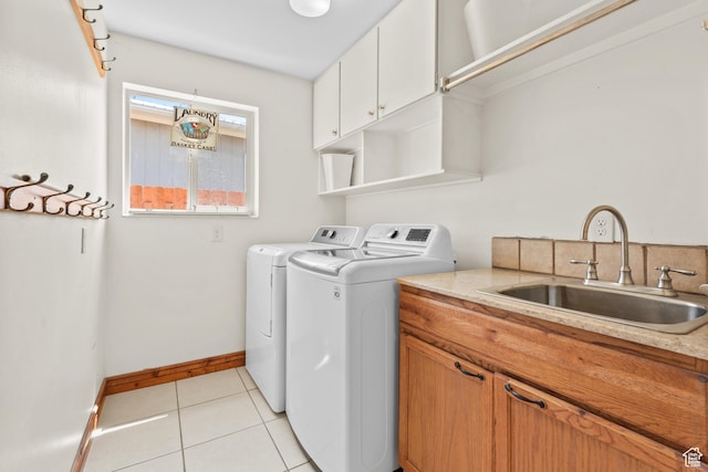3020 Cherokee Ln, Provo, UT 84604 - laundry room featuring separate washer and dryer, cabinet space, and light tile patterned floors