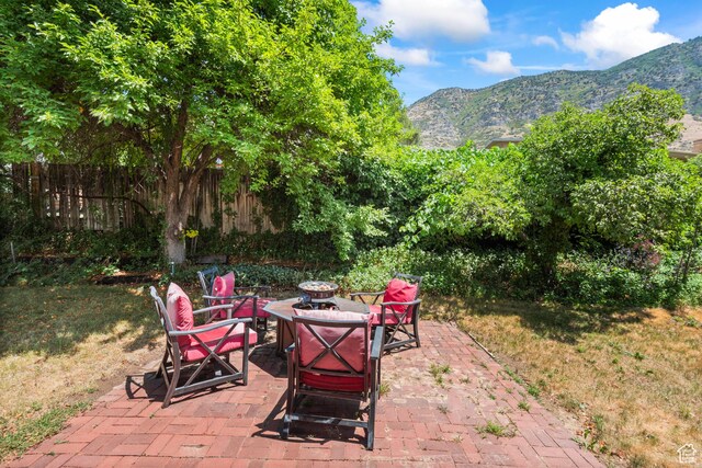 3020 Cherokee Ln, Provo, UT 84604 - view of patio featuring an outdoor fire pit and a mountain view