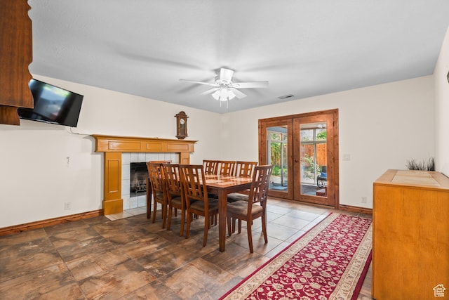 3020 Cherokee Ln, Provo, UT 84604 - dining area featuring french doors, ceiling fan, and a tile fireplace
