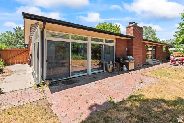 3020 Cherokee Ln, Provo, UT 84604 - rear view of house with a chimney, a patio area, entry steps, and a gate